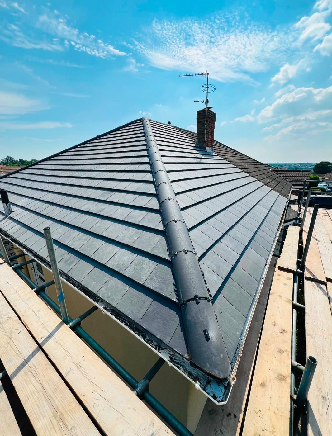 Finished re-tiled roof with ridge and chimney